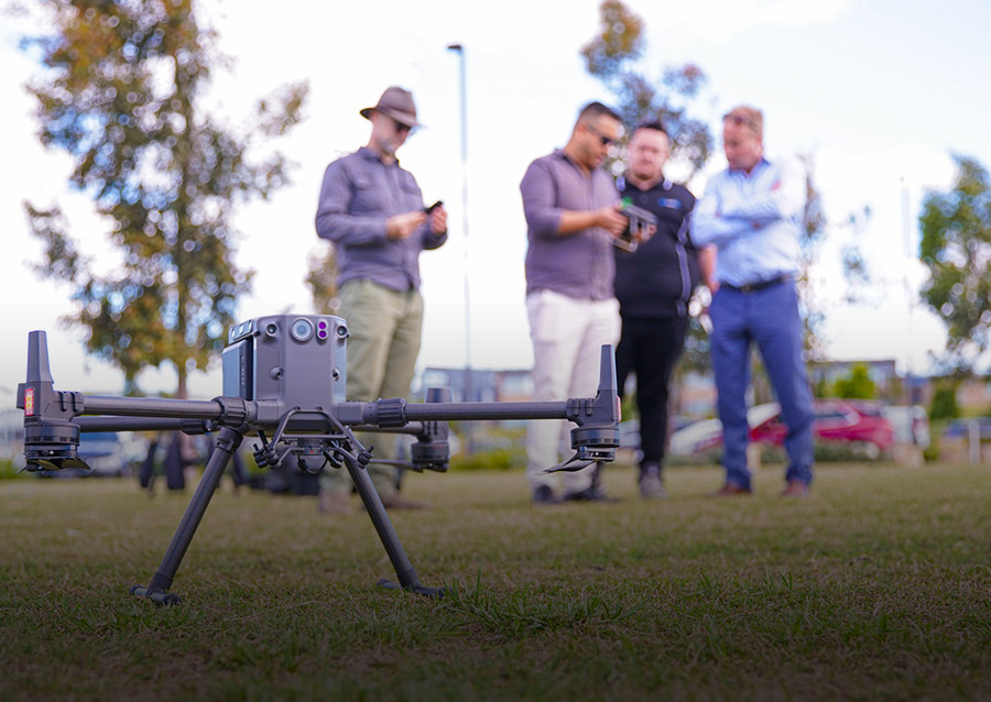 Group of men setting up drone