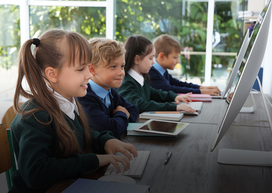 Children facing computer screen